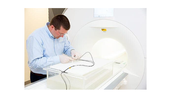 RF induced heating during MRI: Evaluation of a passive implant in an anatomical model